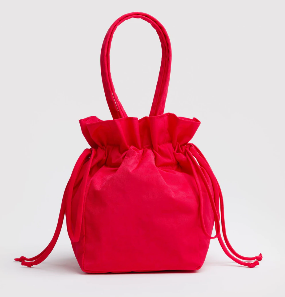 Red drawstring bag on a light gray background