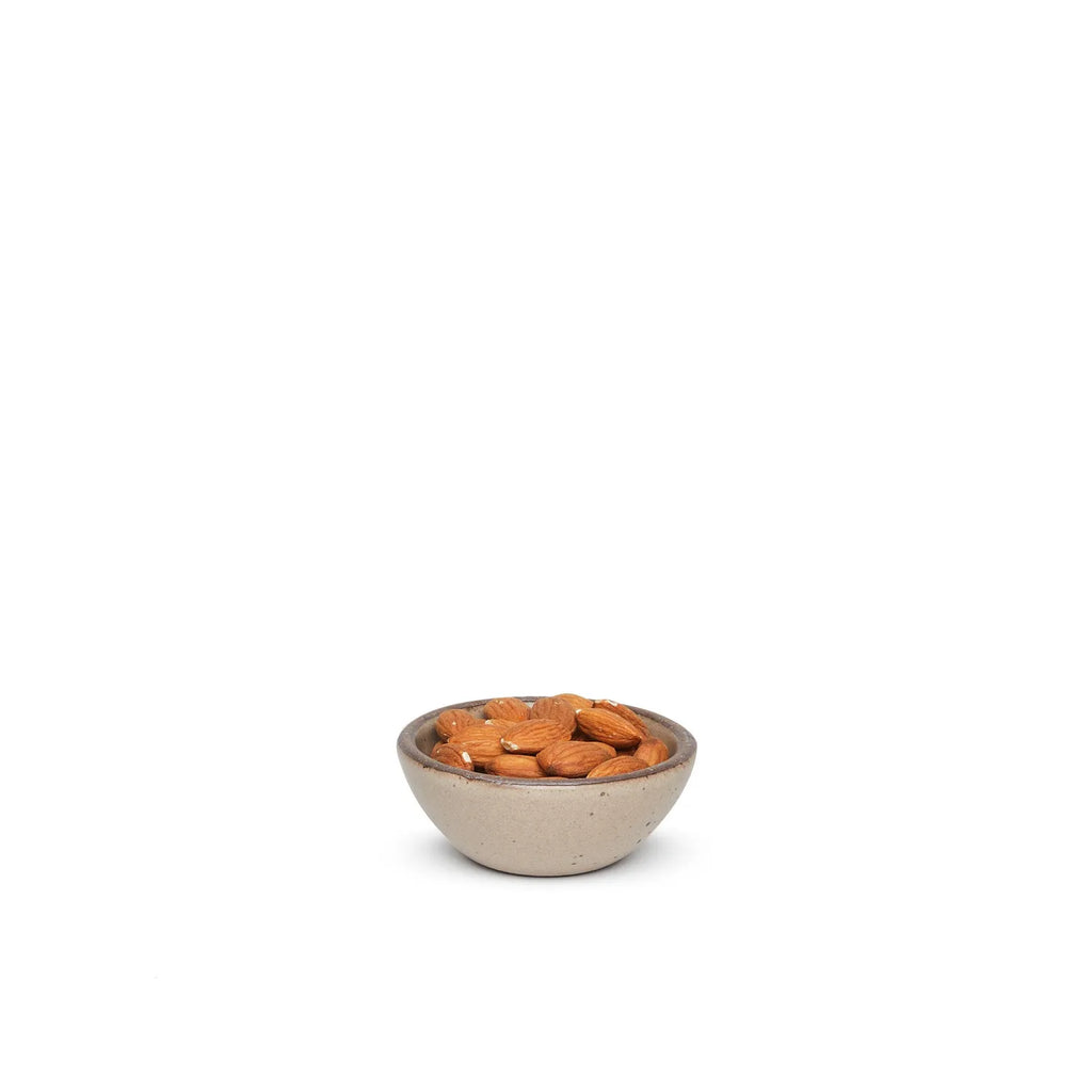 small brown East Fork Pottery bowl with almonds in it