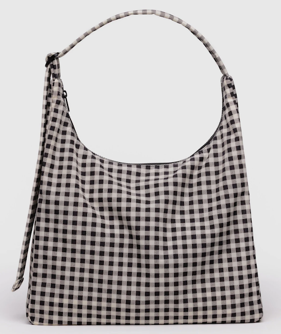 Black and white checkered bag on a light gray background