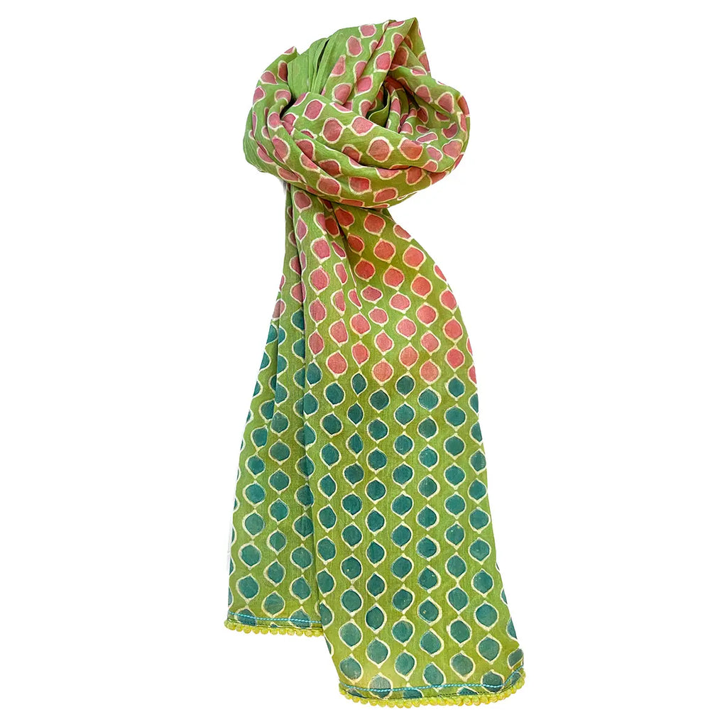 Green and orange polka dot scarf on a white background