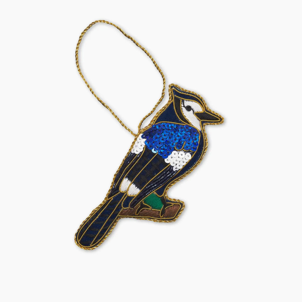 Decorative blue jay bird ornament on a white background
