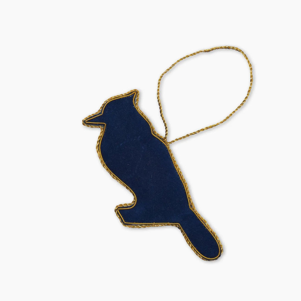 Blue bird-shaped ornament with gold trim on a white background