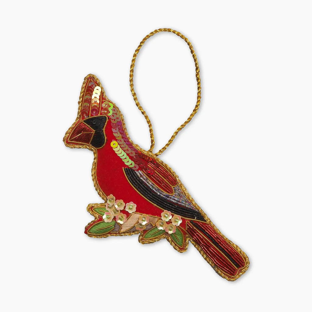 Decorative cardinal ornament with floral details on a white background