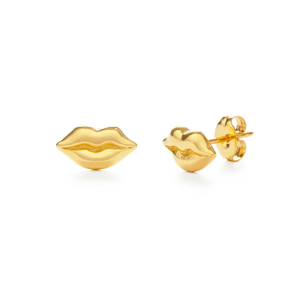 Gold lip-shaped earrings on a white background