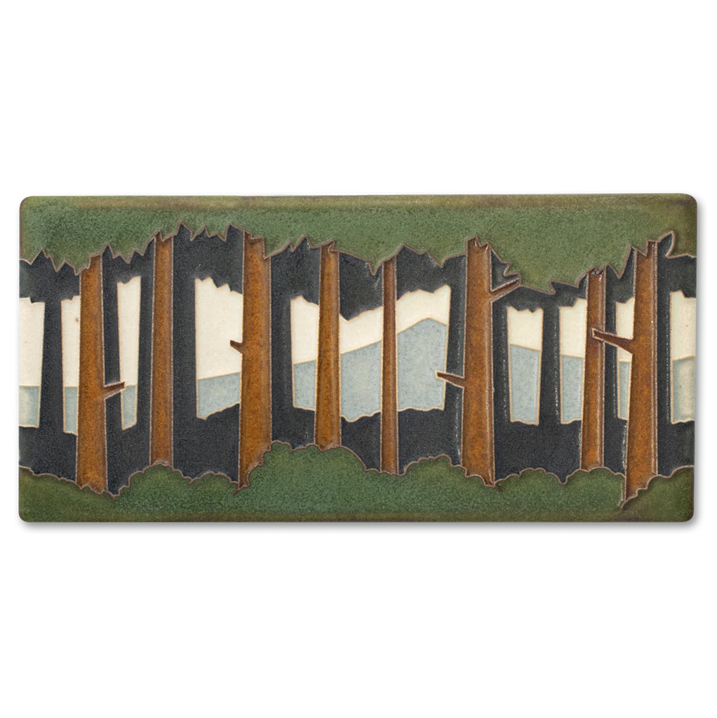 Decorative tile with a forest design on a white background