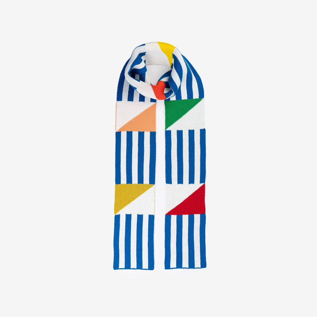 Blue and white striped knitted scarf with green, gold, peach and red triangles on a white background.