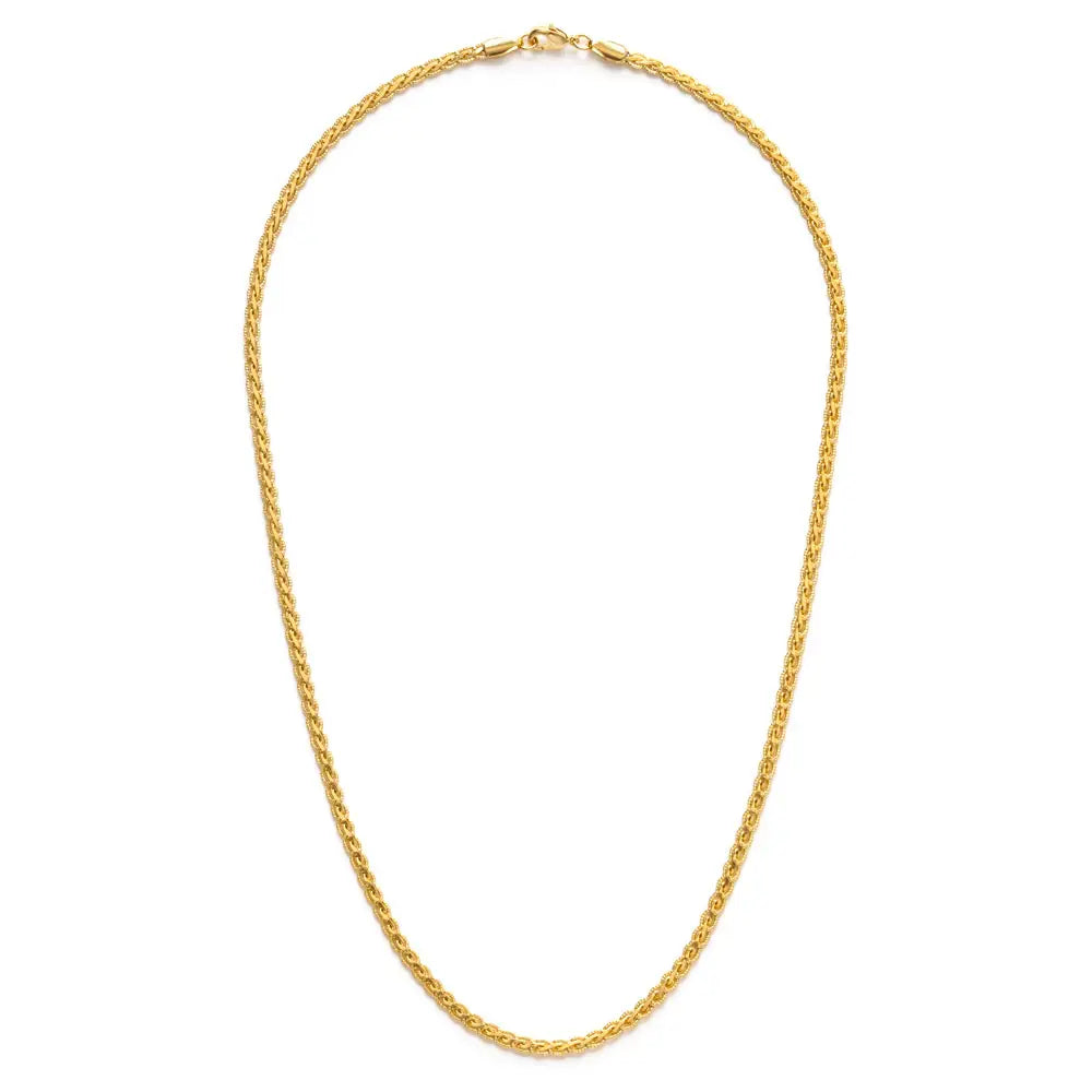 Gold chain necklace on a white background