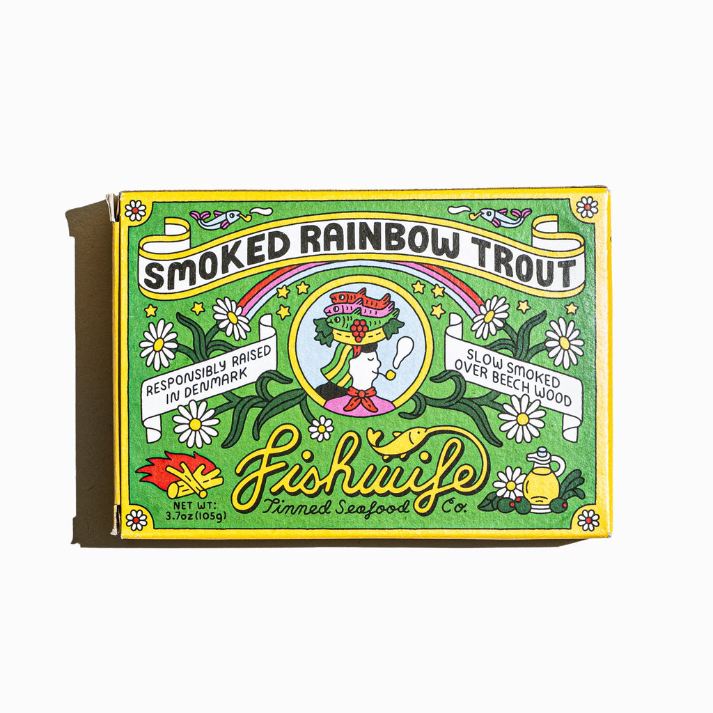 Packaged smoked rainbow trout with decorative label on a white background