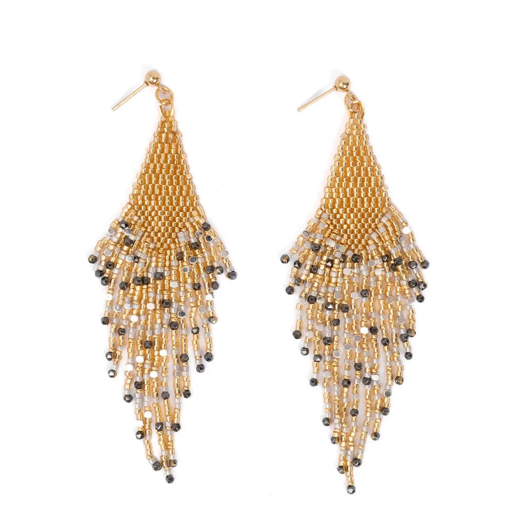 Gold beaded earrings on a white background