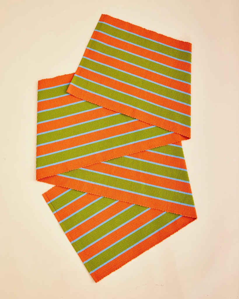 Striped table runner with teal, green and orange pattern on a beige background