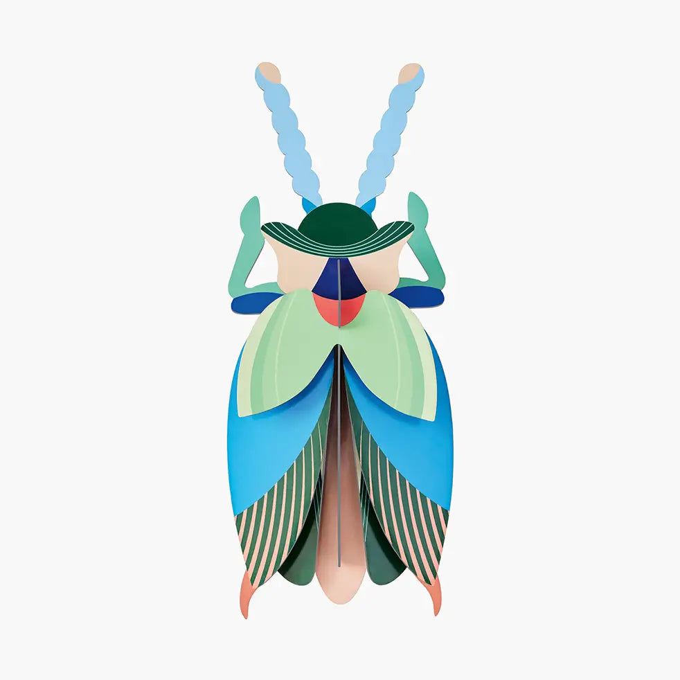 studio roof emerald colored beetle wall art puzzle on white background