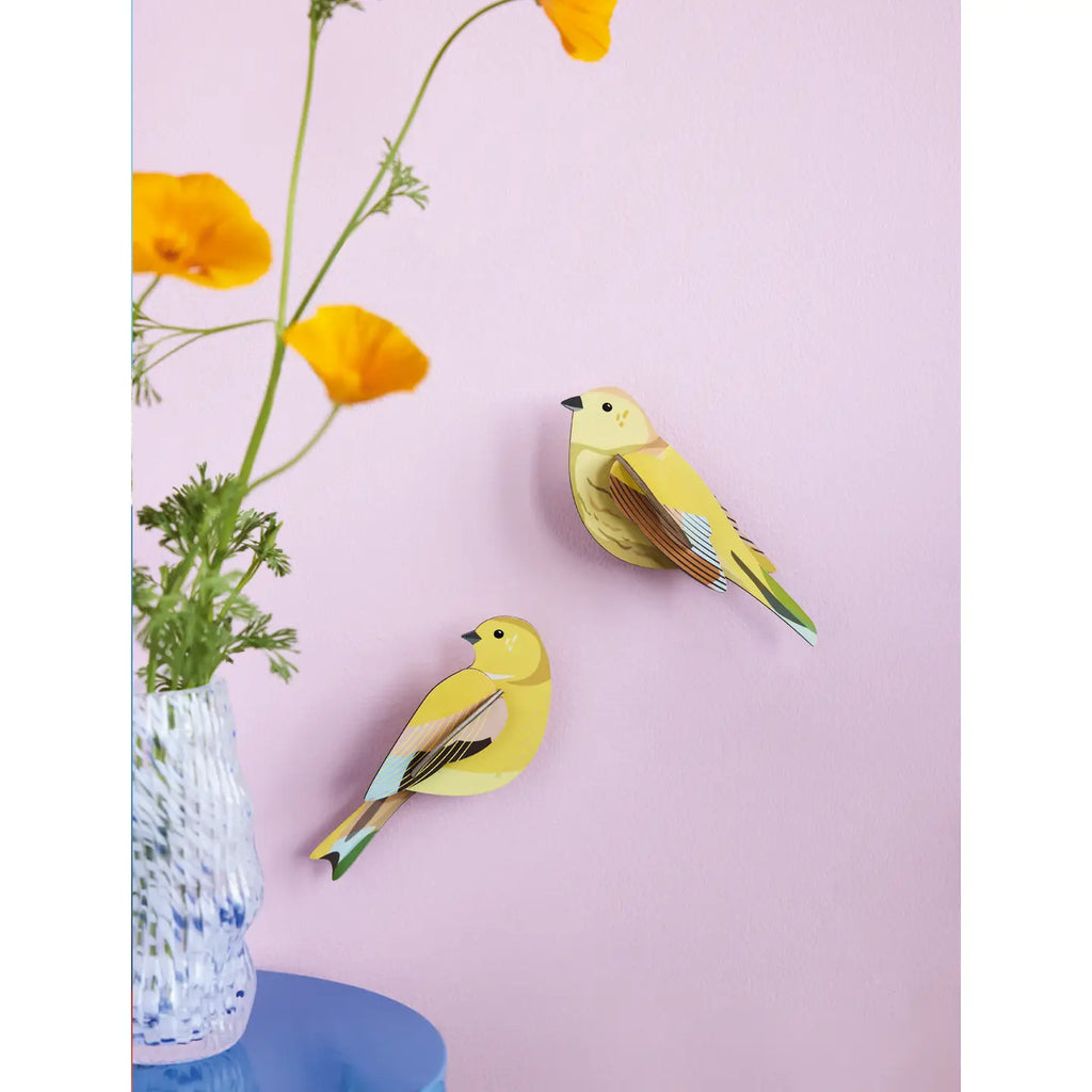 Two studio roof wall art puzzle citrinella birds with yellow feathers on pink background with flowers