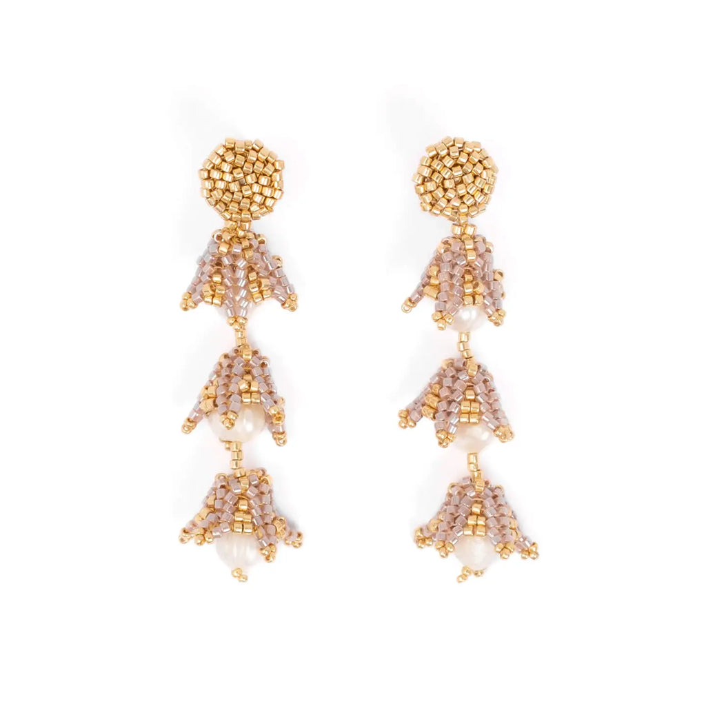 Gold beaded and pearl drop earrings on a white background