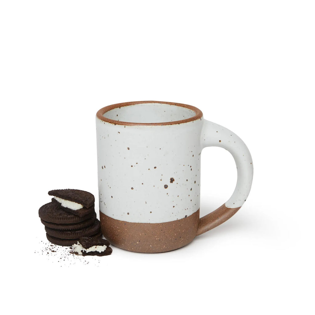 picture of the mug in eggshell by Eastfork pottery, oreo cookies