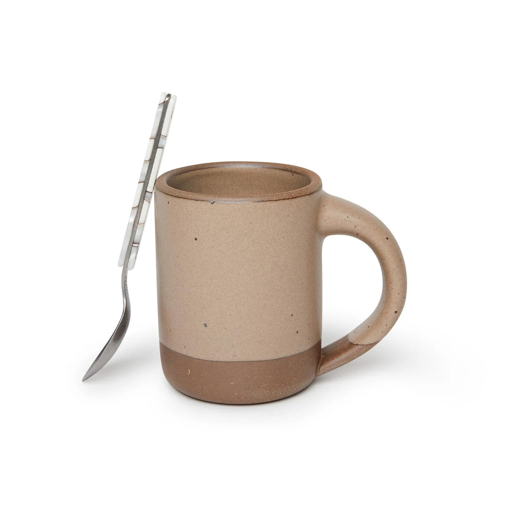 The mug by Eastfork Pottery in morel with a spoon leaning against it