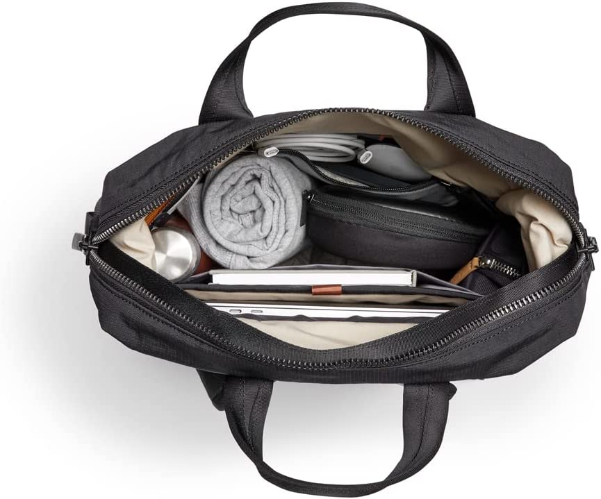 unzipped backpack with items packed inside